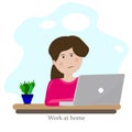 Work at home. Girl is working at a table in a laptop. Royalty Free Stock Photo